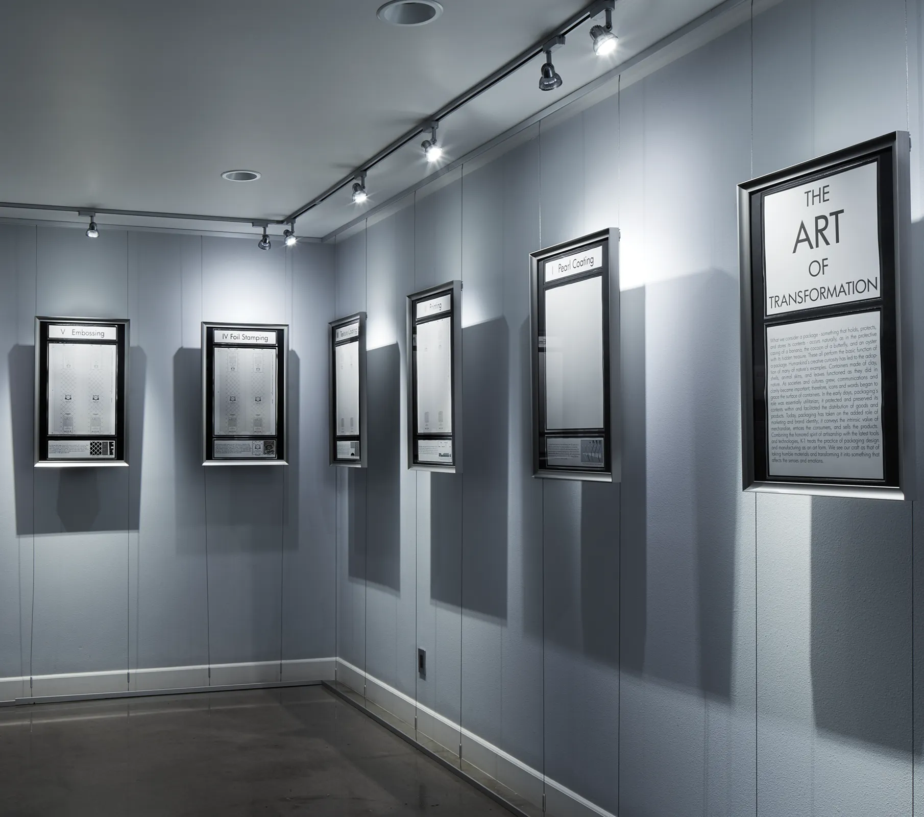 an image of a room with blue wooden paneled walls, with different plaques hung up