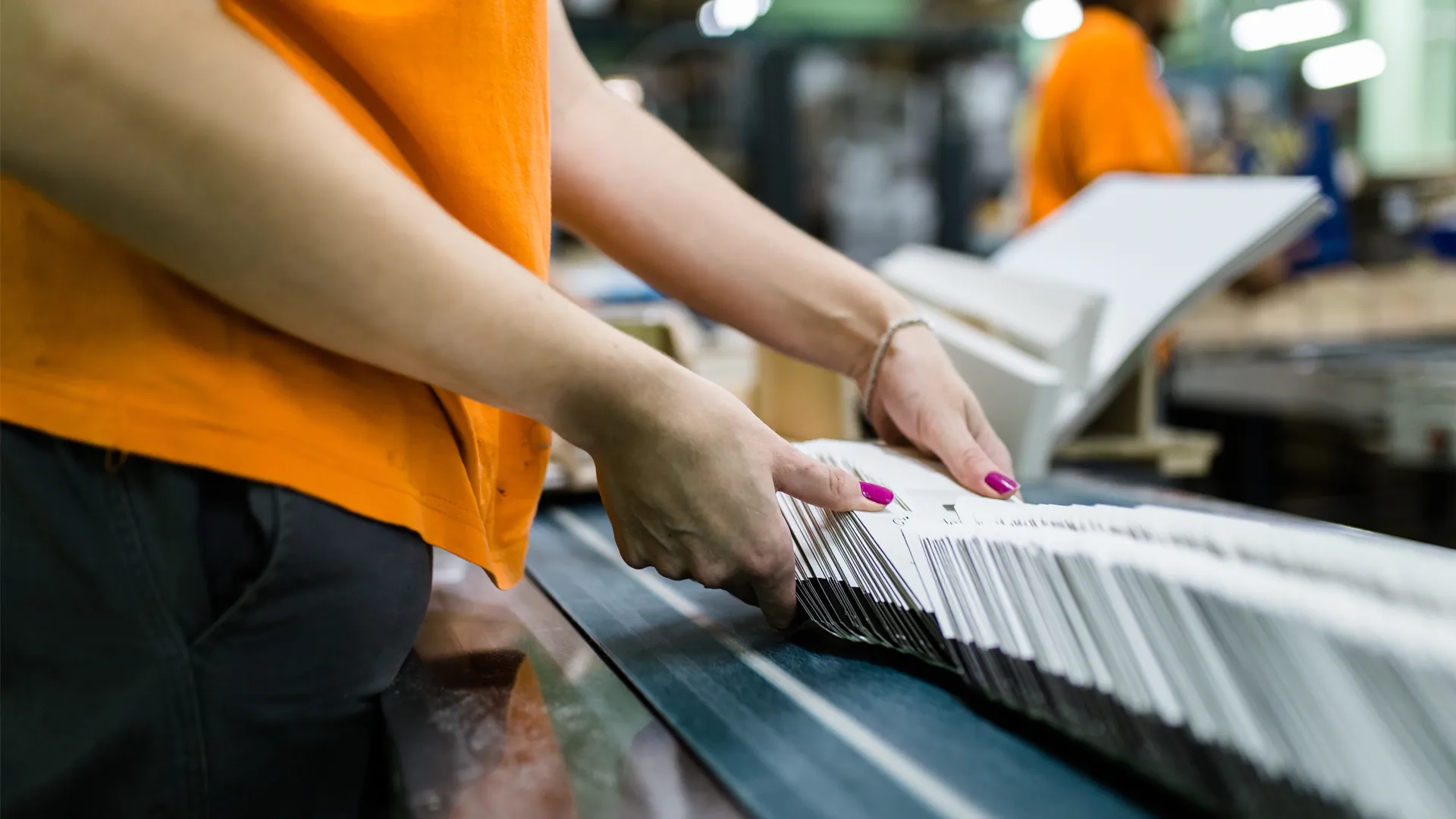 an image of a worker organizing items in a factory setting